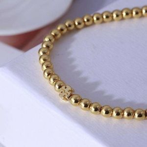 New Tory Burch Gold Stretchy Beaded Logo Bracelet
